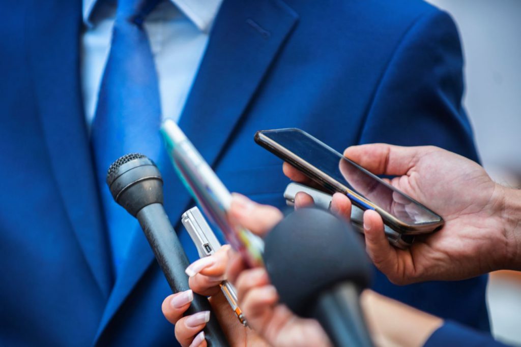 Businessman giving crisis communication press conference